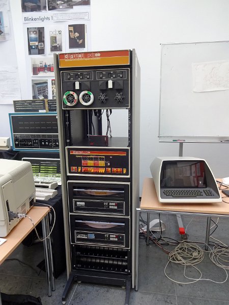PDP_8e_b.jpg - The PDP8/e mini-computer rack with tape storage (on top), CPU and Winchester type hard disks. This machine has a word size of 12 bit .                               