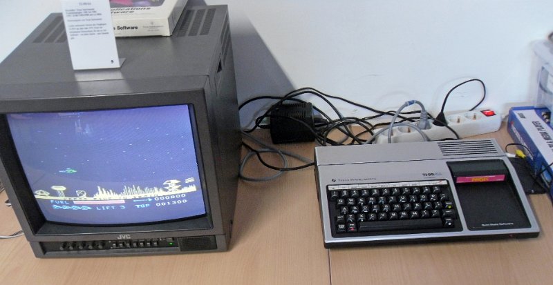 TI_99_4A.jpg - The TI 99/4A microcomputer from 1981 with a game cartridge inserted.
