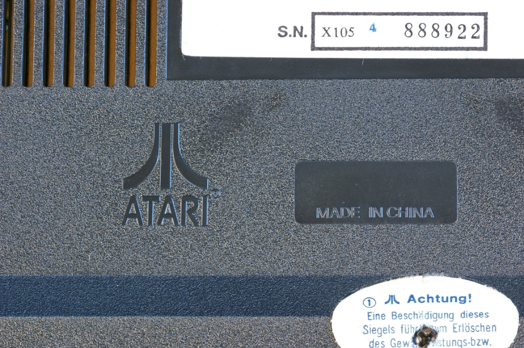 DSC03383.JPG - Close-up on the embossed Atari logo and the "Made in China" inscription.
