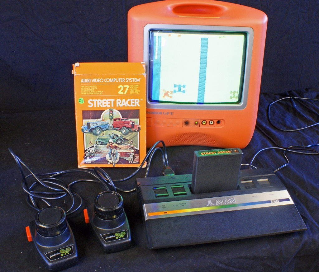 DSC03385.JPG - The Junior connected to a color TV and running the dual player Strett Racer game. This game uses dual paddles connected to a single joystick port.