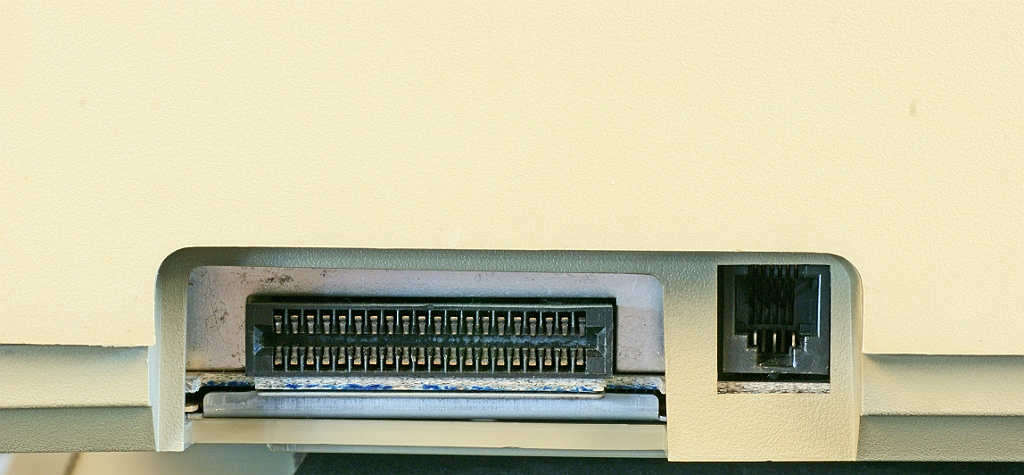 DSC03826.JPG - ROM cartridge and RJ12 (keyboard) connectors on the left side.
