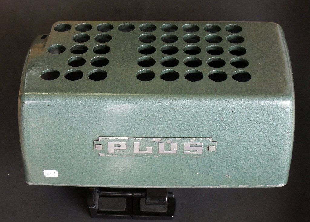 SDC13801.JPG - Backside of the cover with the "PLUS" label of the Bell Punch Plus calculator series.
