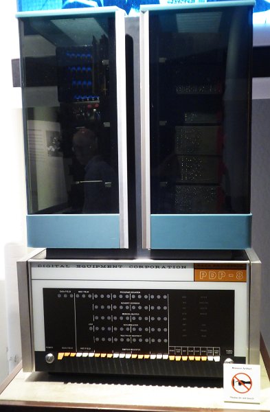 CHM059a.JPG - The DEC PDP-8 was found in universities and research labs. The lower case is the computer, the blue cabinets hold hard disk for storage.