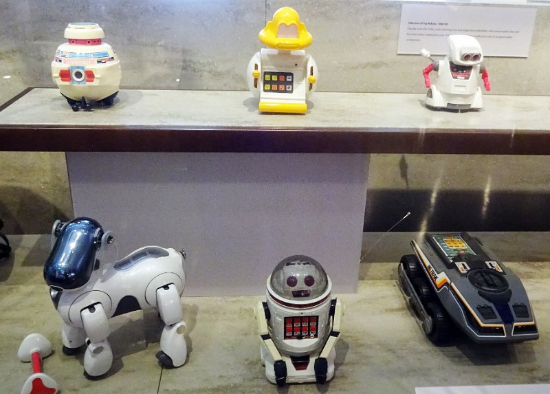 CHM065.JPG - Some early toy robots. The car at the right is a BIGTRACK from 1980 (also on display at the Computarium).