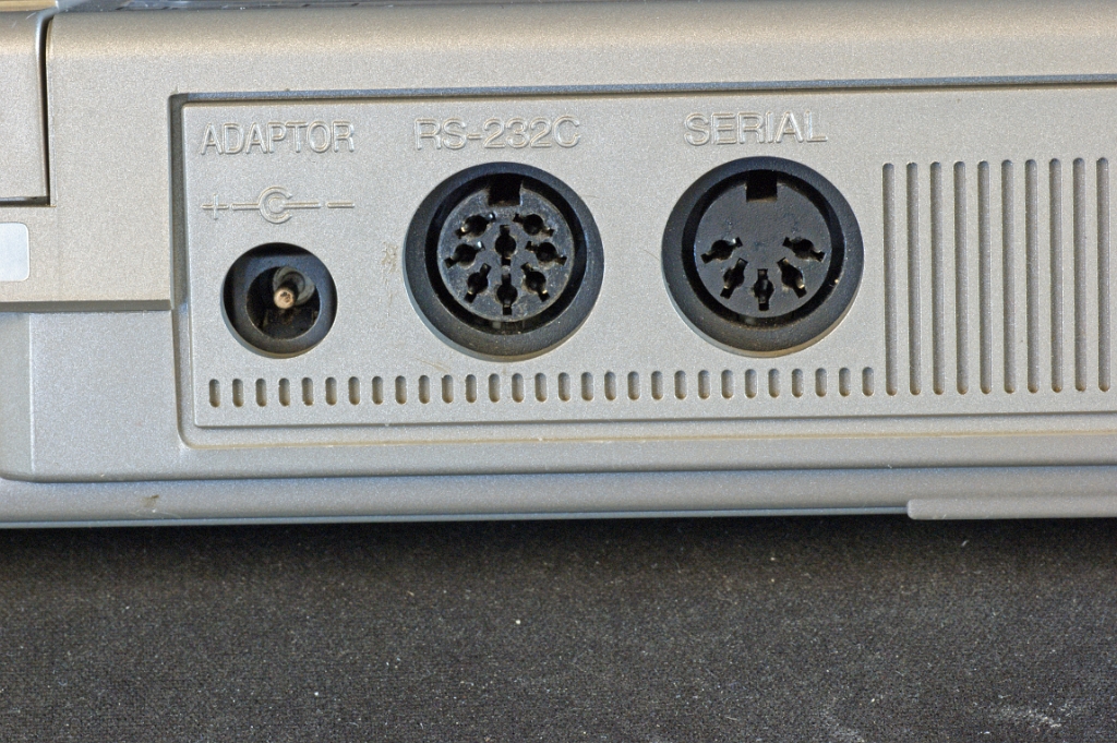 DSC03164.JPG - Backside with power, serial RS232 and peripheral serial (e.g. floppy drive) connectors.