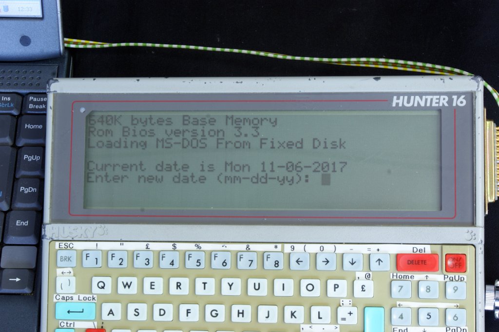 DSC07869.JPG - The second boot screen showing base memory and loading DOS from "Fixed Disk" = ROM memory.