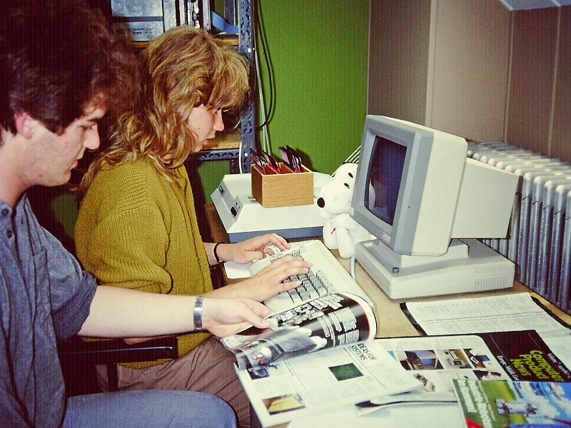 LCDinfo_1984.012.JPG - Students working on the terminal of a SWTPc microcomputer system. This single-user system was assembled by Jean Mootz and Francis Massen in 1977 and used for many years. The operating system was FLEX.