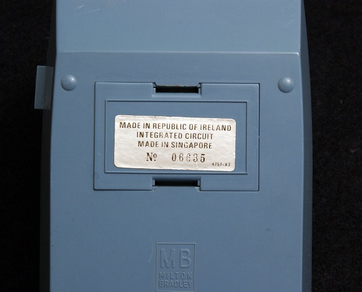 DSC05582.JPG - Backside of the light  blue plastic case with serial 06635 and "Made in Ireland" label. The cover closes a 9V battery compartment; an external power supply also may be used.