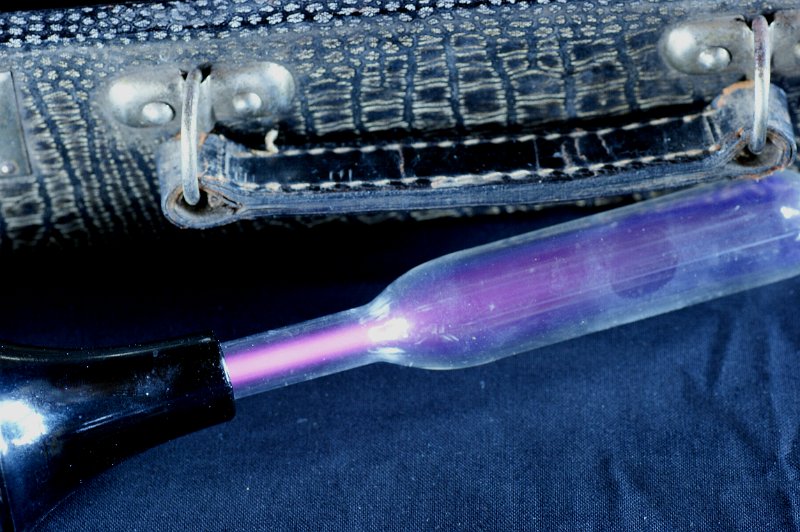 DSC02374.JPG - Glass electrode with violet gas discharge.